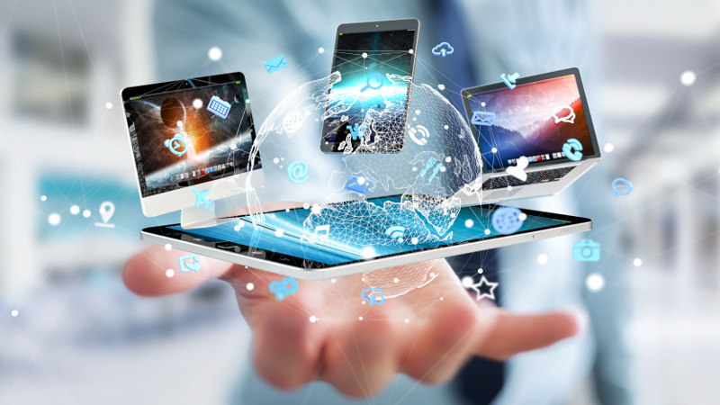 Businessman on blurred background connecting tech devices 3D rendering